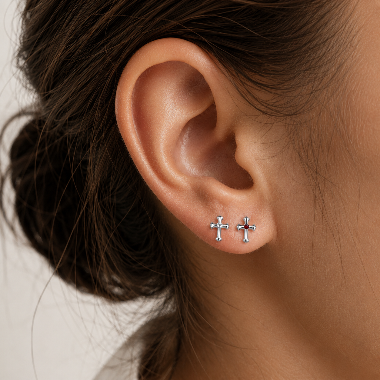 Woman wearing titanium cross cartilage stud during everyday lifestyle moments