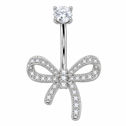 Close-up of Dazzling Titanium Bow Belly Button Ring with 3 CZ stones, left tail shorter than right, mirror-polished finish