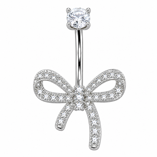 Close-up of Dazzling Titanium Bow Belly Button Ring with 3 CZ stones, left tail shorter than right, mirror-polished finish