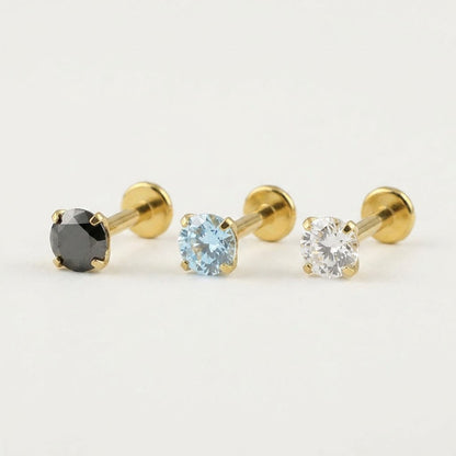 Premium mirror-polished gold titanium flat back stud earring featuring a secure 4-prong clear zircon setting for helix and tragus piercings.