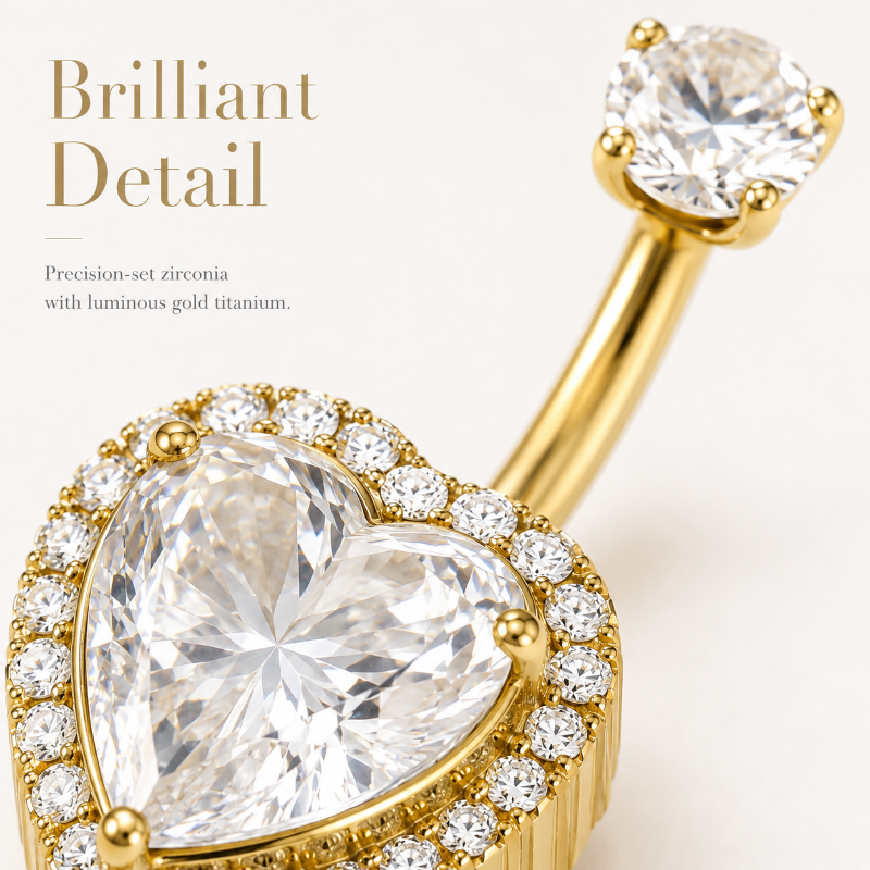 Close-up detail of zircon titanium belly button ring with polished gold finish