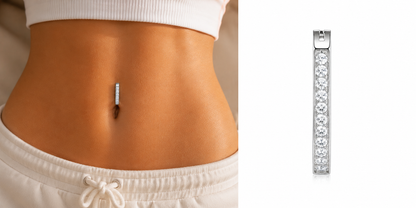 Young woman wearing a minimalist titanium belly ring with pavé zircon detail styled for modern luxury summer fashion.