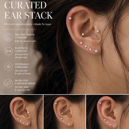 Curated ear stack with multiple titanium flat back CZ piercing studs in helix, conch, and lobe piercings