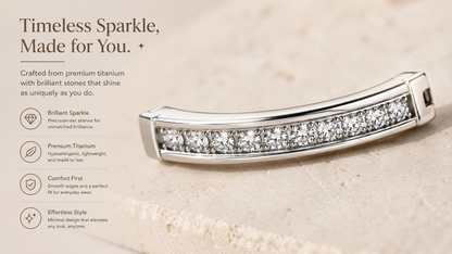 Close-up macro view of polished titanium belly ring with precision pavé zircon stones and smooth luxury finish.