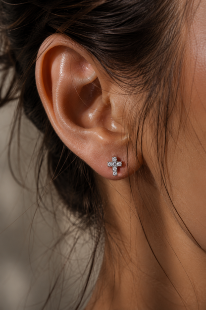 Sleep-friendly titanium flat back cross stud designed for comfortable overnight wear