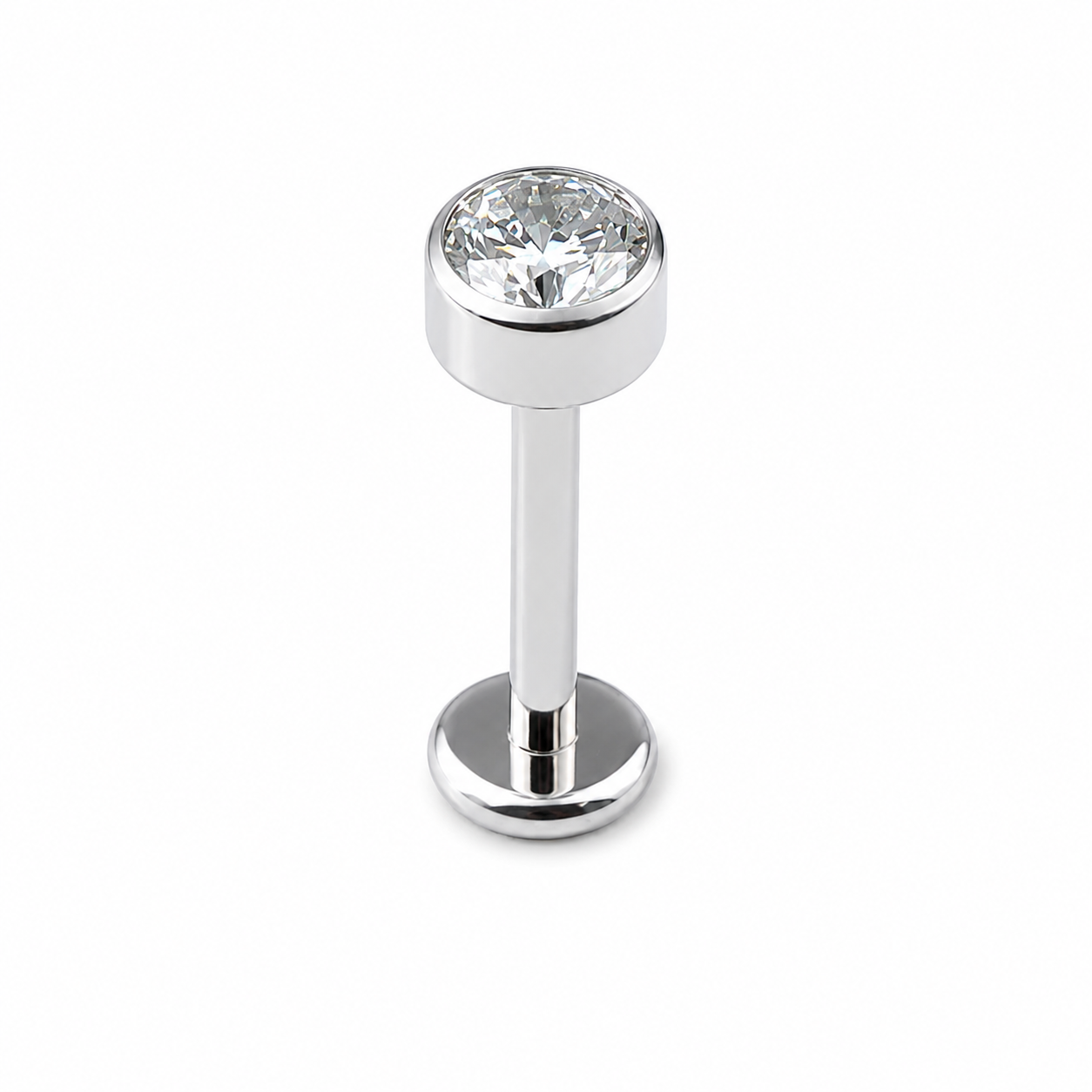 Implant grade titanium flat back labret stud with bezel set cubic zirconia and internally threaded design on white background