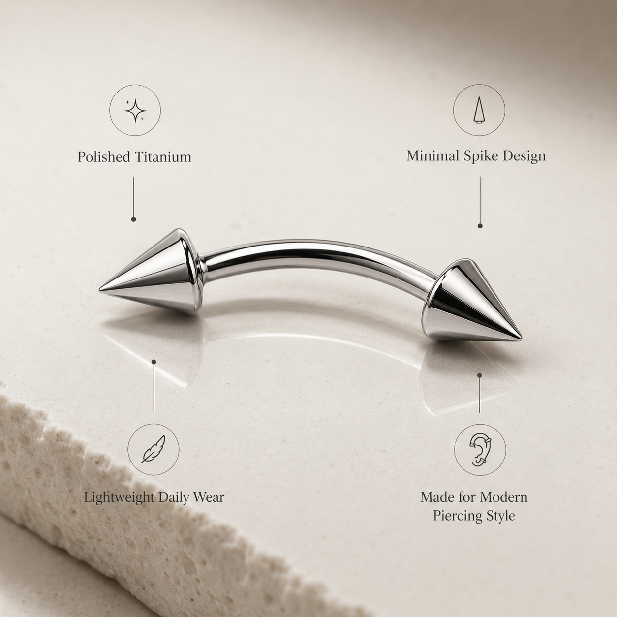 Polished titanium spike curved barbell eyebrow ring with lightweight minimal piercing design