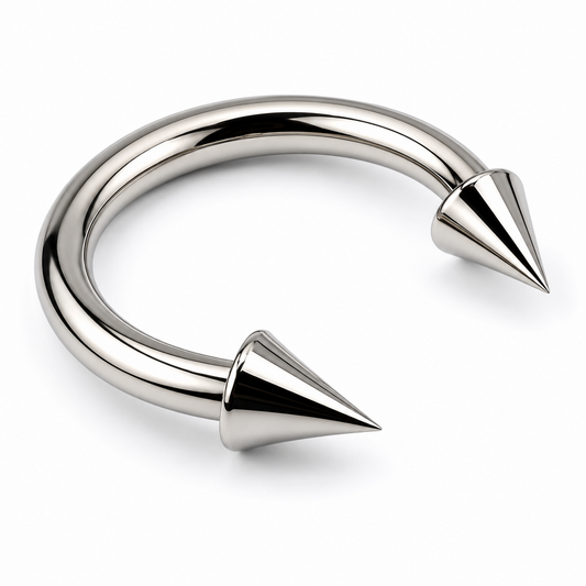Titanium spike horseshoe nose ring with polished curved bar and cone ends on clean white background